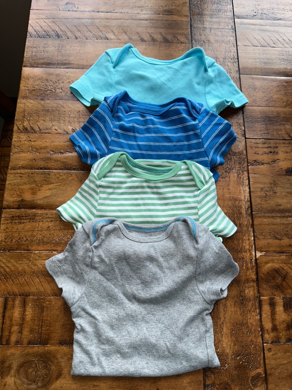 cloud island Four-Pack Short-Sleeve Baby Onesies in Aqua, Blue, Green, Gray